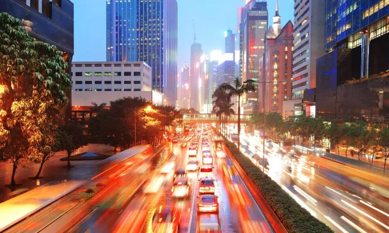 a city street with cars and buildings